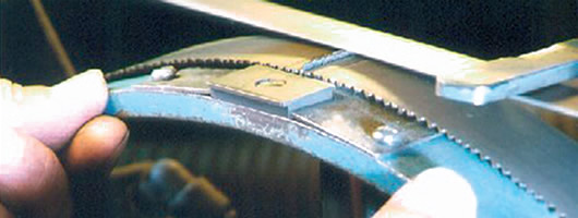 Saw blade servicing and sharpening