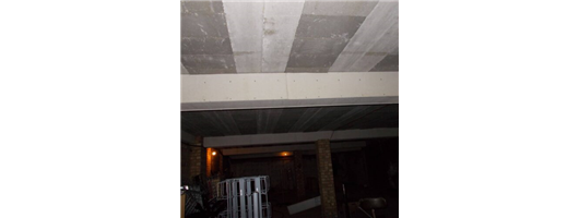 Raw Asbestos Insulating Board Cladding to Beam