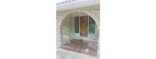 Glass Porch Frameless Locking Handle Cut to shape of brickwork Dorset Bespoke