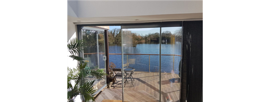 Frameless Glass Curtains Double Glazed Round Glass Handle Riverfront Ely Bespoke