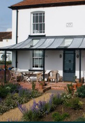 Veranda with Cast Columns & a Glass & Zinc Roof in West Sussex