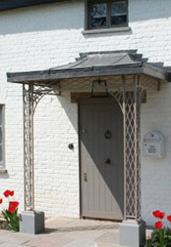 Treillage Porch with Forest of Dean Stone Plinths & Lead Roof in Hertfordshire