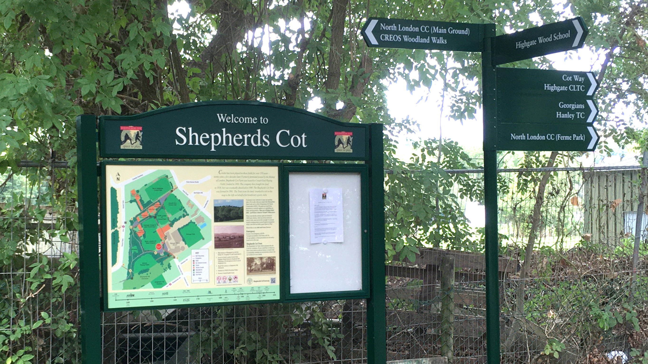 An interpretation panel with a park map, lockable notice board, header panel and posts beside a directional finger post with 5 arms.  Shelley Signs