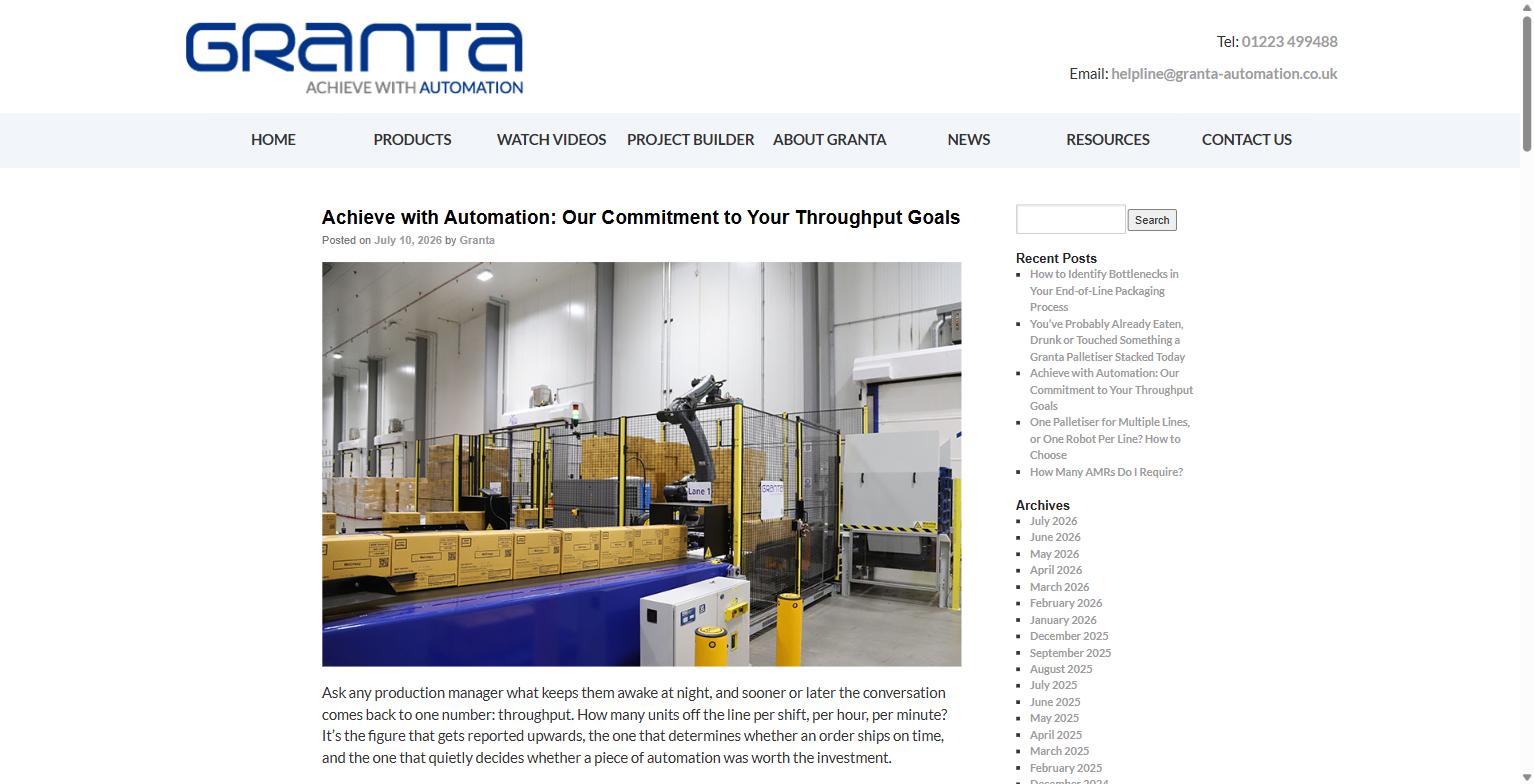 Robotic palletiser cell handling boxes on a production line
