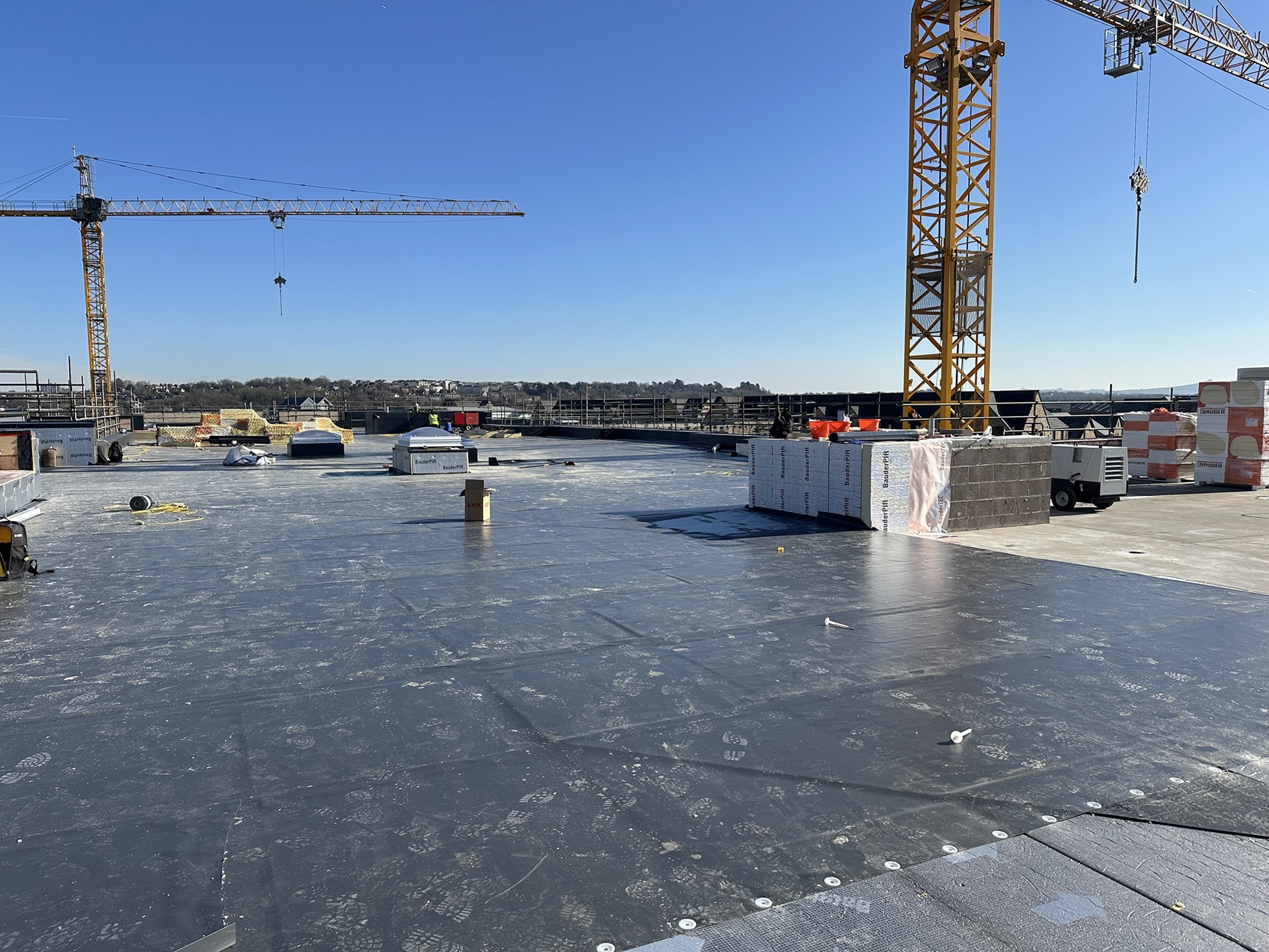 Given the cold and wet weather at the time, applying the proposed adhesive when planned was not possible, hence why a mechanical fixing solution was advantageous.