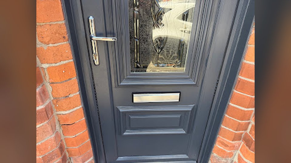 Grey composite front door with new handle fitted in Belfast