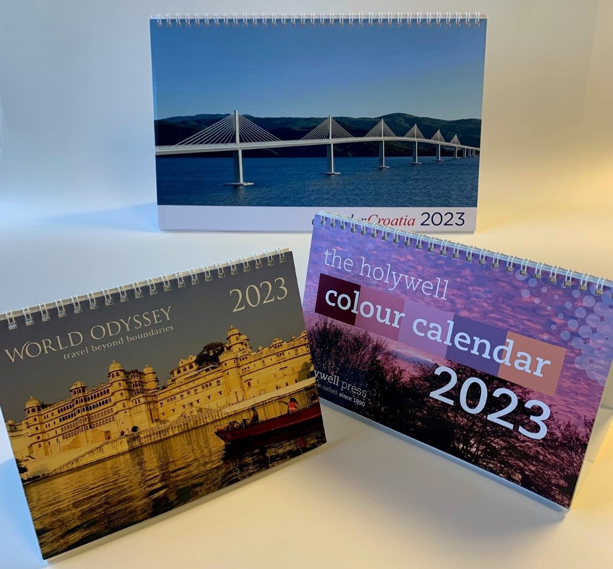 Three printed desk calendars