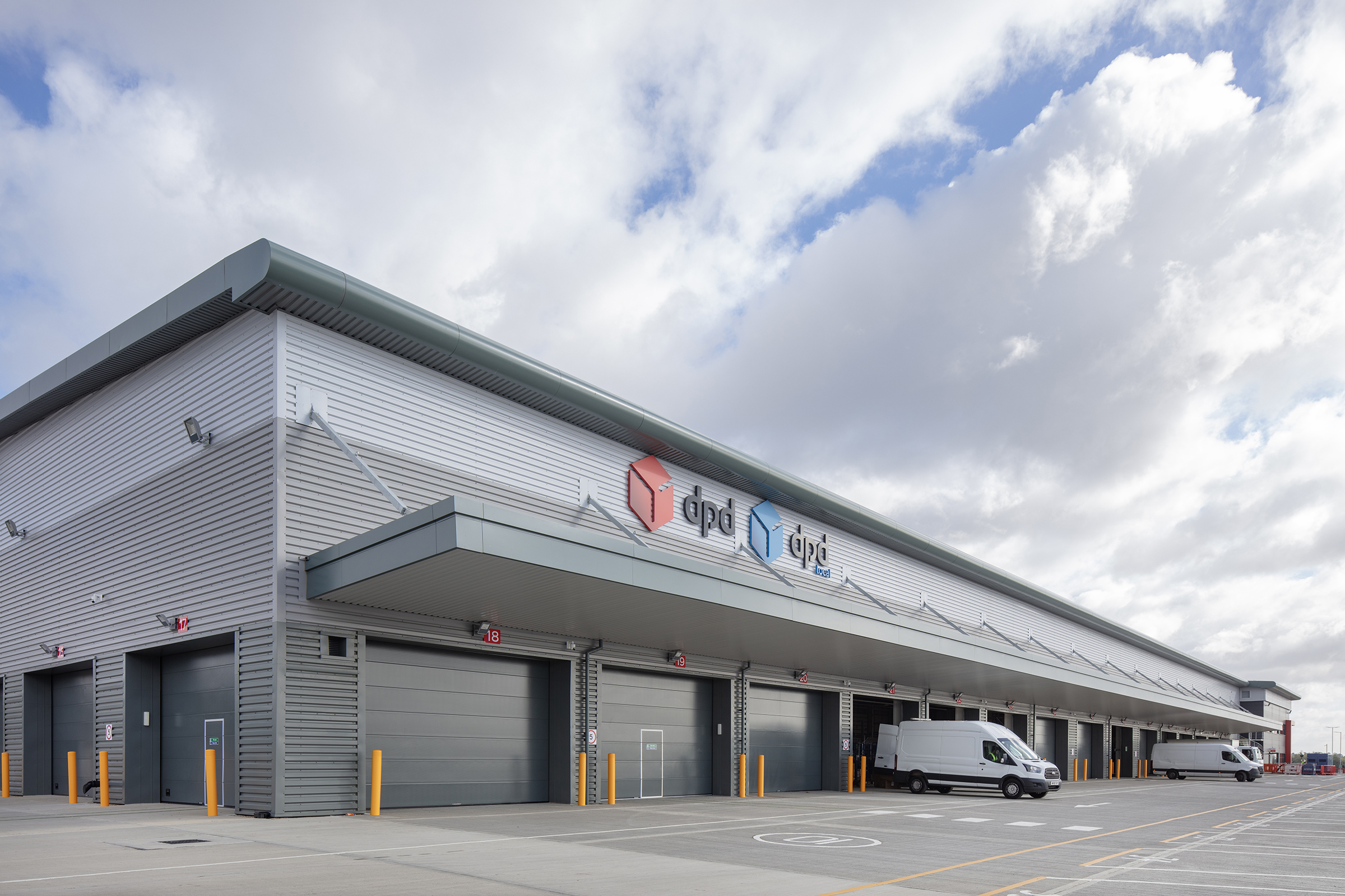 A row of Crawford OH1042P sectional overhead level doors at a DPD site