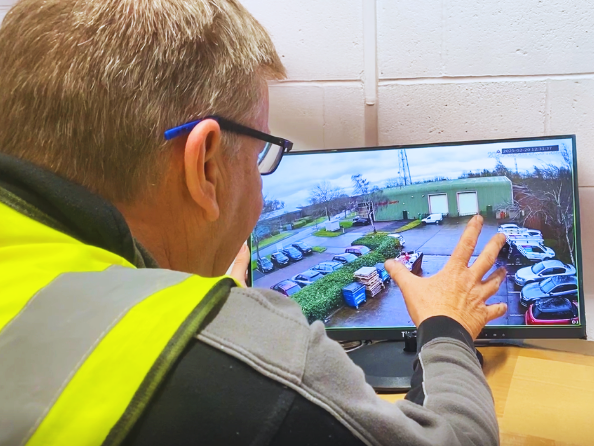 Engineer monitoring a venue using a CCTV security system