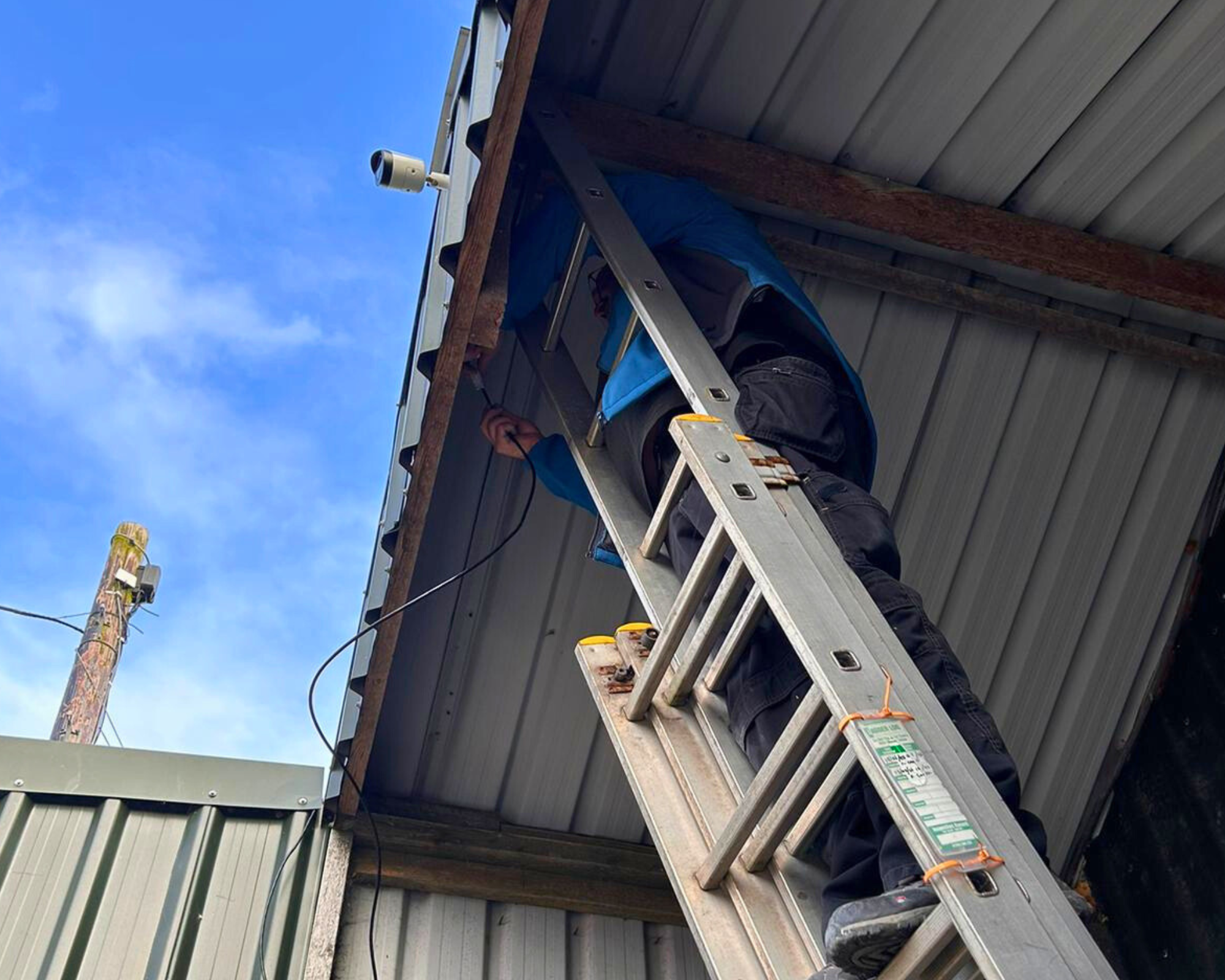 AdaptiveComms Engineer Installing CCTV Camera Installation