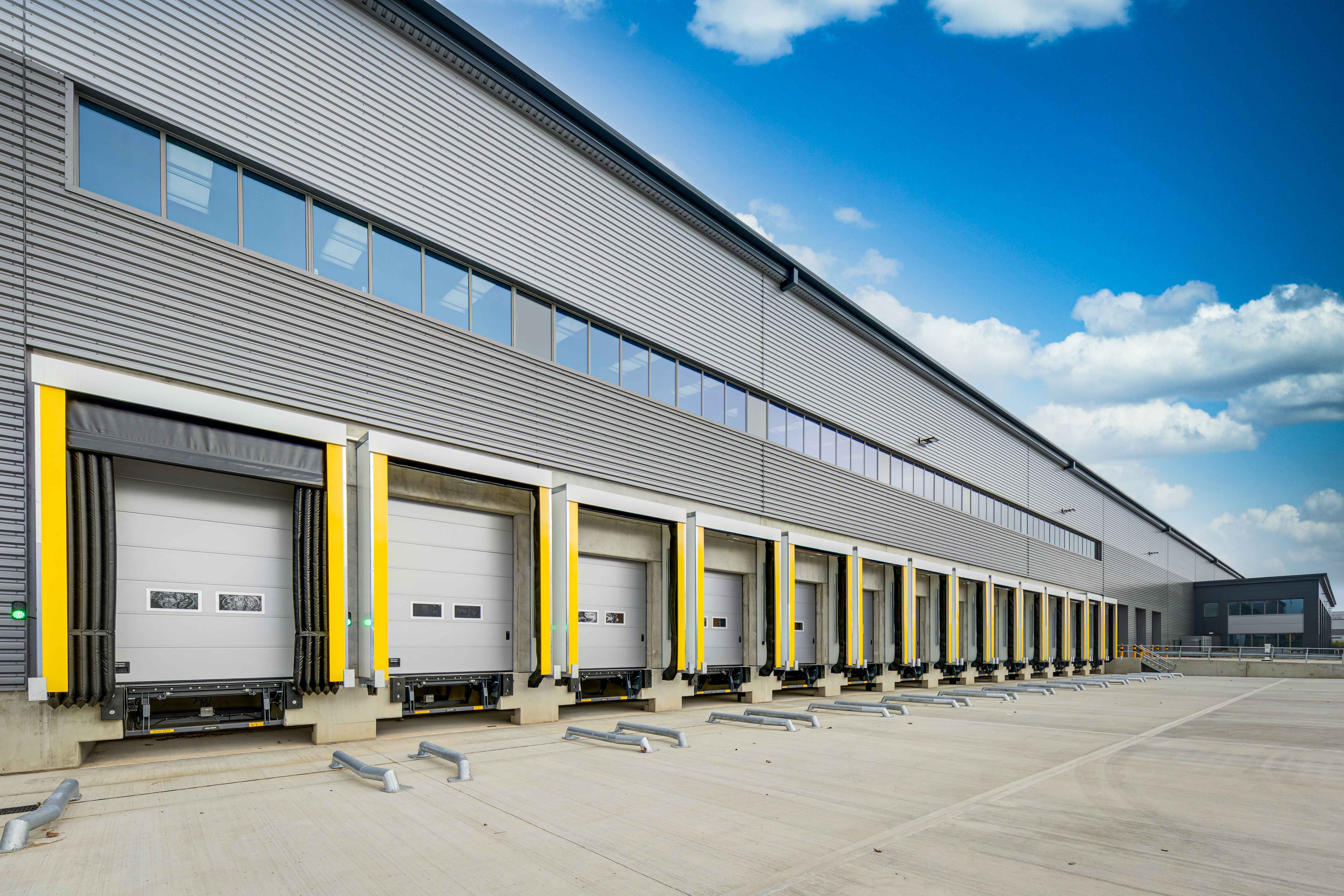 A row of loading bays featuring the ASSA ABLOY DS6070R inflatable dock shelter