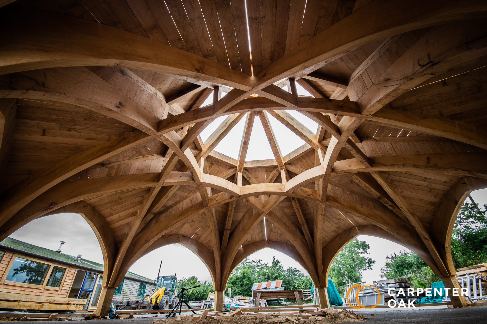 Octagonal oak-frame roof structure under construction in the Radley College workshop yard