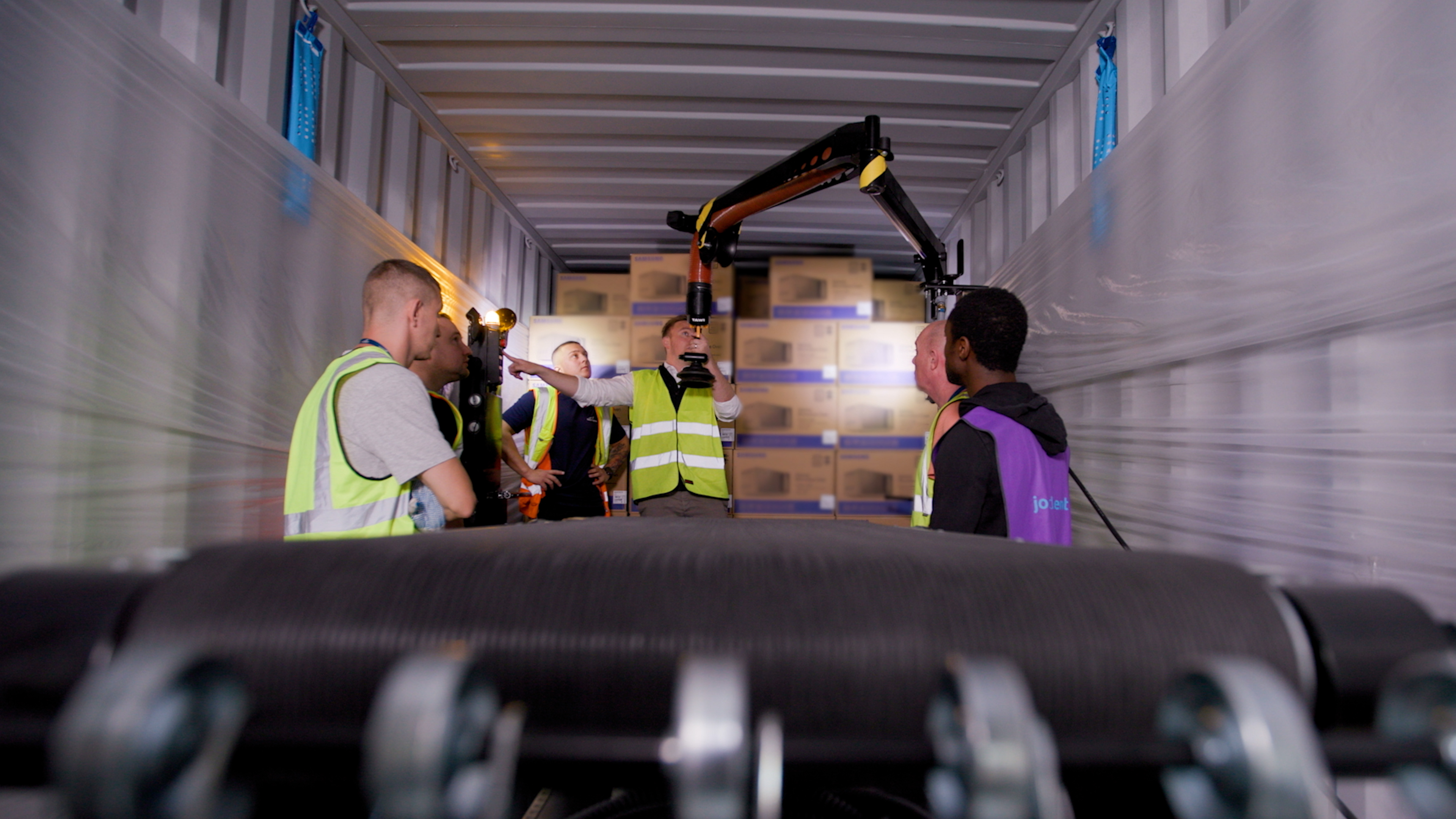 TAWI Container Unloader unloading boxes from lorry