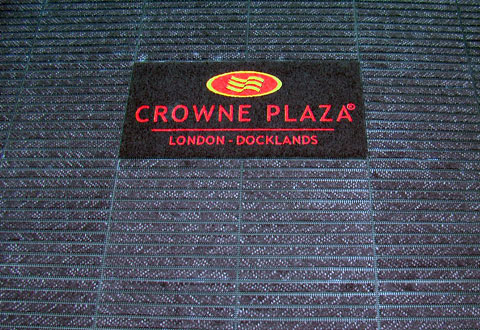 High-quality entrance matting system installed in a busy commercial building lobby, designed for high-traffic areas to enhance safety, cleanliness, and brand visibility.