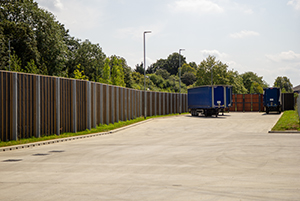 Absorptive acoustic barrier for haulage company