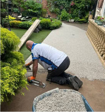 Resin bound flooring being applied to a back garden