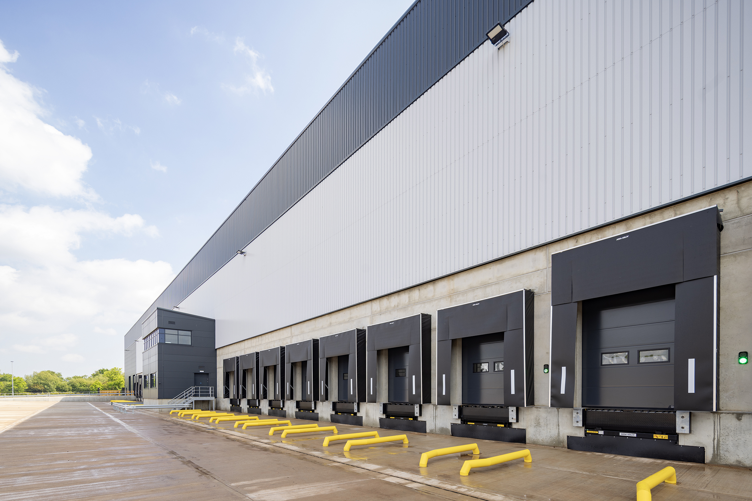 A row of loading bays featuring the Crawford OH1142P dock door