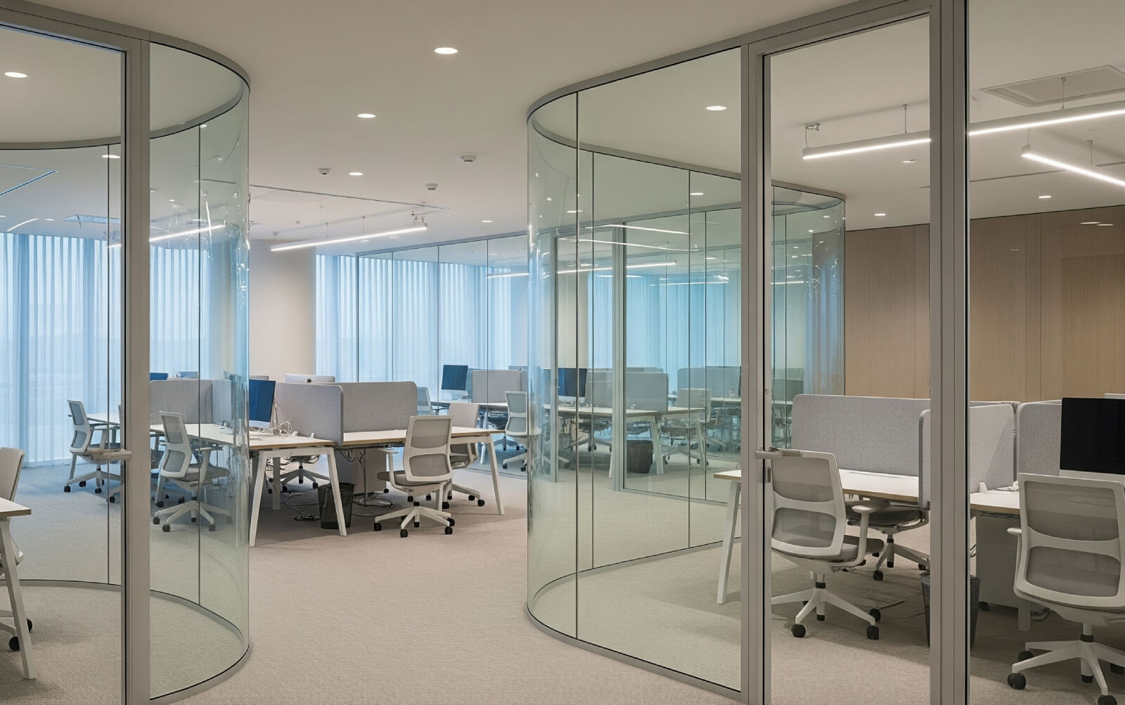 Designer office space with curved glass partitions